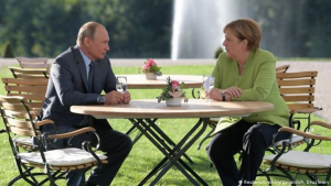 Putin and Angela Merkel