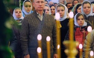 Putin visibly participating in the Orthodox Religion